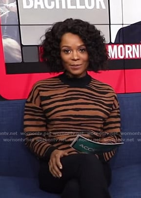 Zuri's brown tiger print sweater on Access Hollywood