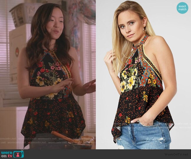 Janet’s black floral asymmetric top on Kims Convenience