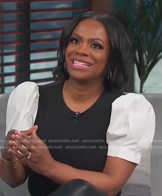 Kandi Burruss’s black and white puff sleeve top on Access Hollywood