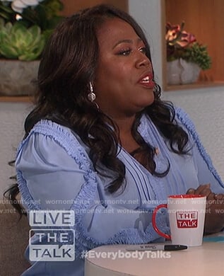 Sheryl’s blue ruffle trim blouse on The Talk