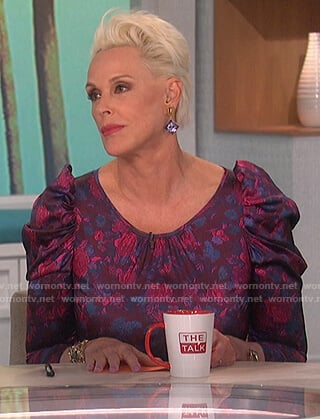 Brigitte Nielsen’s purple floral mini dress on The Talk