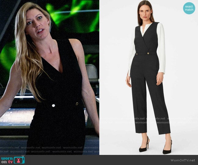 black jumpsuit with gold buttons