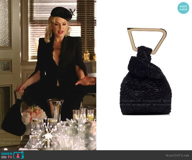 Astraea Faux Fur Top Handle Bag by Cult Gaia worn by Alexis Carrington (Elaine Hendrix) on Dynasty