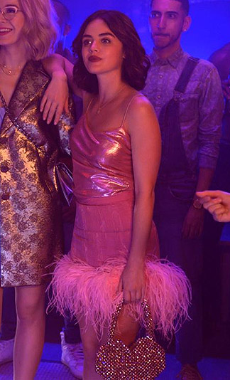 Katy’s pink metallic cami and feather trim skirt on Katy Keene