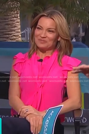 Kit’s pink ruffle tie neck top on Access Hollywood