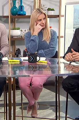 Morgan’s blue sweater and pink trousers on E! News Daily Pop