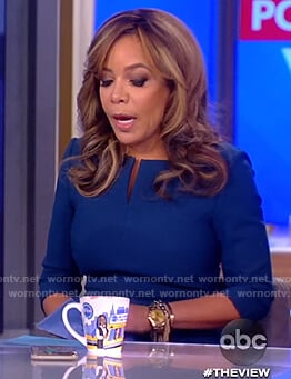 Sunny’s navy split neck sheath dress on The View