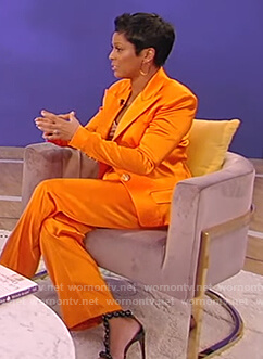 Tamron’s orange satin blazer and pants on Tamron Hall Show