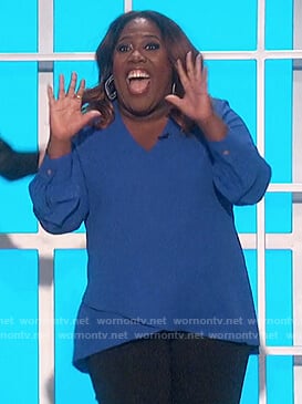 Sheryl’s blue v-neck top on The Talk