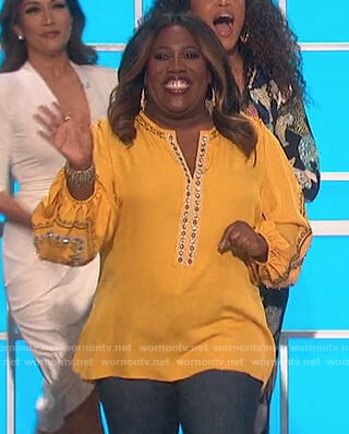 Sheryl’s yellow embellished blouse on The Talk