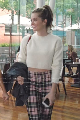 Sutton's white cropped sweater and pink plaid pants on The Bold Type
