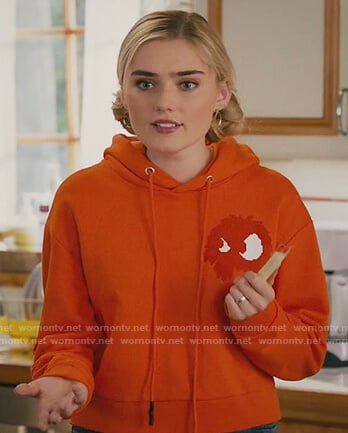 Taylor's orange monster hoodie on American Housewife