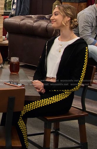 Brooke's black and yellow checkerboard track suit on The Expanding Universe of Ashley Garcia