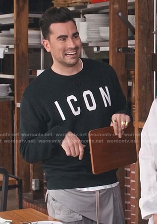 David's black Icon print sweatshirt and grey pants on Schitts Creek