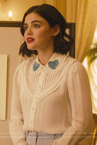 Katy's white blouse with blue sequin heart collar on Katy Keene