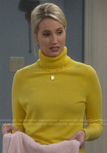 Mandy's yellow turtleneck sweater on Last Man Standing