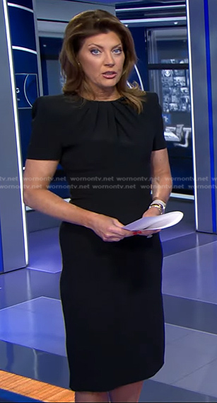 Norah's black pleated neck sheath dress on CBS Evening News
