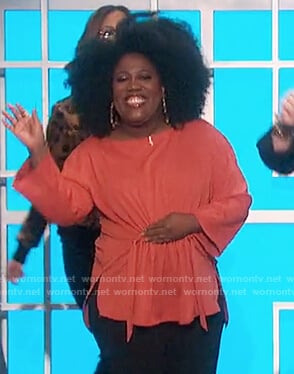 Sheryl’s orange adjustable waist top on The Talk