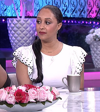 Tamera's white ruffle embroidered top on The Real