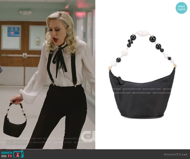 Gia shoulder bag by Cult Gaia worn by Alexis Carrington (Elaine Hendrix) on Dynasty