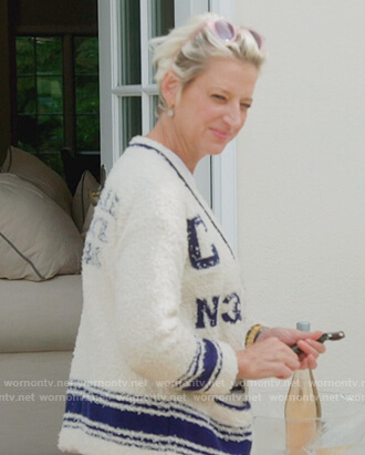 Dorinda’s white Chanel logo cardigan on The Real Housewives of New York City