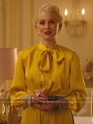 Gloria’s yellow tie neck dress on Katy Keene