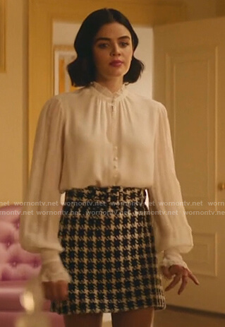 Katy’s white blouse and houndstooth belted mini skirt on Katy Keene