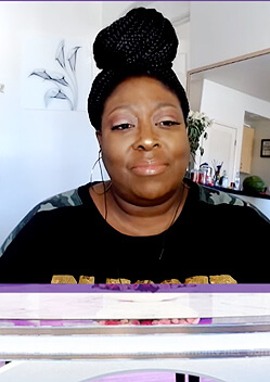 Loni’s black sequin blessed sweatshirt on The Real
