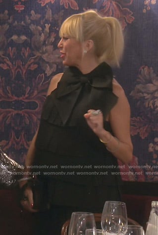 Sutton's black bow-embellished pleated dress on The Real Housewives of Beverly Hills