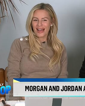 Morgan’s beige embellished button sweater on E! News Daily Pop