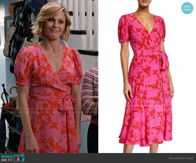 Claire’s pink and red printed wrap dress on Modern Family