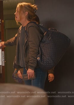 Jen's blue quilted travel bag on Dead to Me