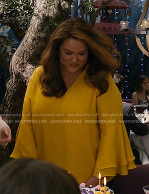 Katie’s yellow bell sleeve blouse on American Housewife