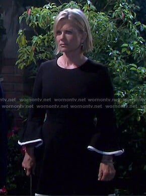 Kayla’s black bell sleeve dress with white piping on Days of our Lives