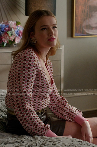 Kirby's pink geometric cardigan and leather mini skirt on Dynasty