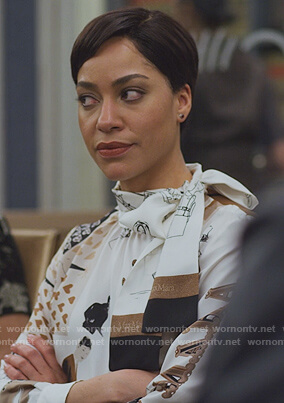 Lucca’s white printed tie neck blouse on The Good Fight