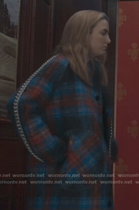 Villanelle's blue plaid coat and chain trim skirt on Killing Eve