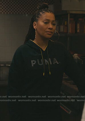 Dominique’s black puma sweater on The Chi