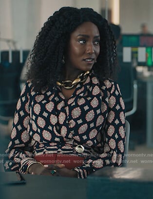 Lauren’s black printed wrap blouse on Billions