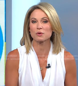 Amy’s white sleeveless wrap top and striped pants on Good Morning America