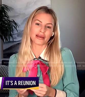 Morgan’s green blouse with pink bow on E! News Nightly Pop