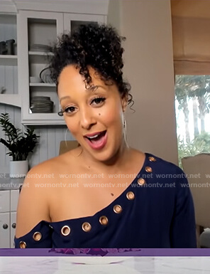 Tamera's navy grommet one off-shoulder top on The Real