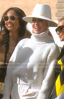 Erika's white ribbed turtleneck sweater and belted pants on The Real Housewives of Beverly Hills