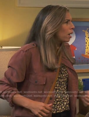 Jo’s burgundy jacket on United We Fall