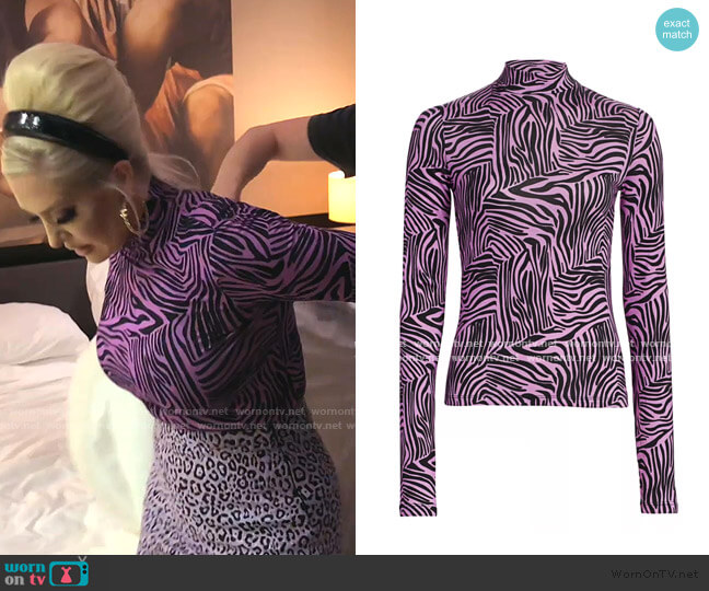 Beth Zebra-Print Turtleneck Top by Andamane worn by Erika Jayne on The Real Housewives of Beverly Hills