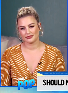 Carissa’s mustard dotted wrap top on E! News Daily Pop