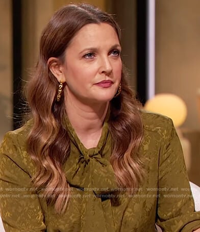 Drew’s green silk tie neck blouse on The Drew Barrymore Show