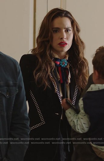Ginger’s black studded blazer and bow neck blouse on Filthy Rich