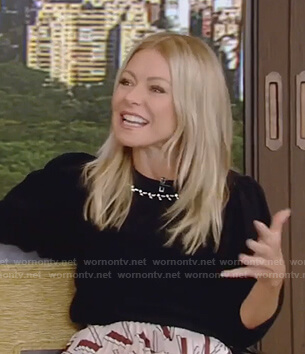 Kelly’s black embellished sweater and print skirt on Live with Kelly and Ryan