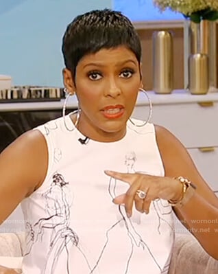 Tamron’s white sleevless printed dress on Tamron Hall Show